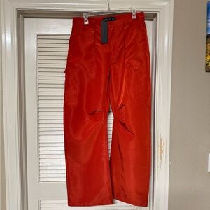 Lioness Miami Vice Red Cargo Pants with satin effect fabric.